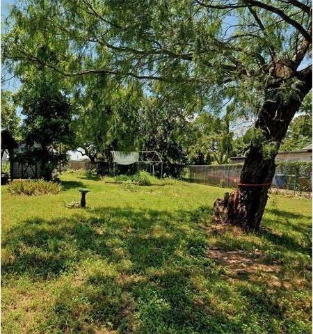 Garden structure, storage building and tree have b