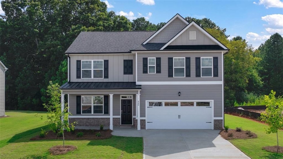 Craftsman inspired home with a garage and a front 