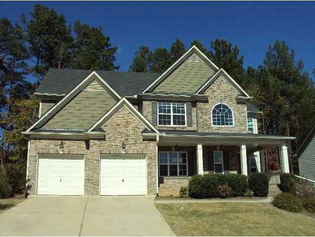Exterior Front. Attractive brick and stack stone f