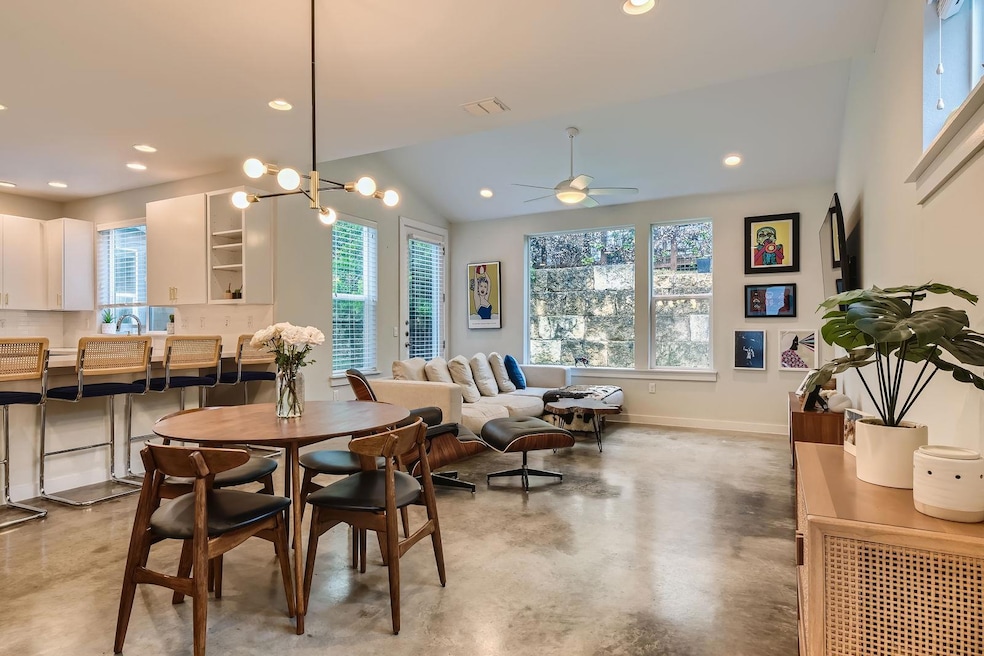 Dining space featuring concrete flooring, healthy