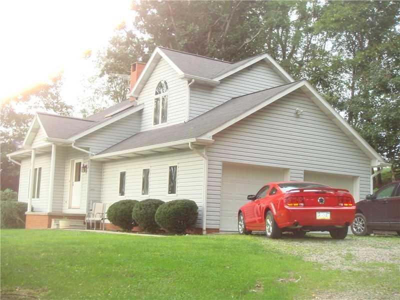Exterior Front. Custom built home on almost an acr