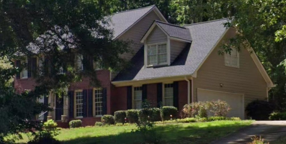 View of front facade featuring a garage