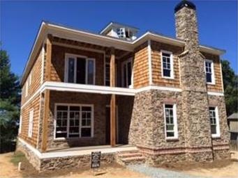 Front of Home.  Double front porches with French d