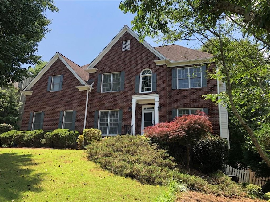 View of front facade featuring brick siding