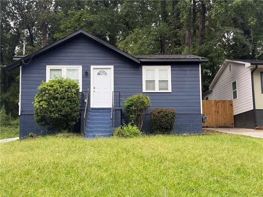 Bungalow-style house with a front yard