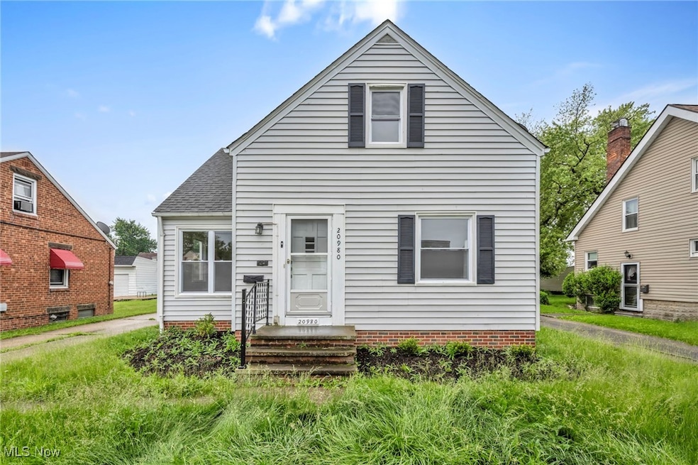 Bungalow featuring roof with shingles