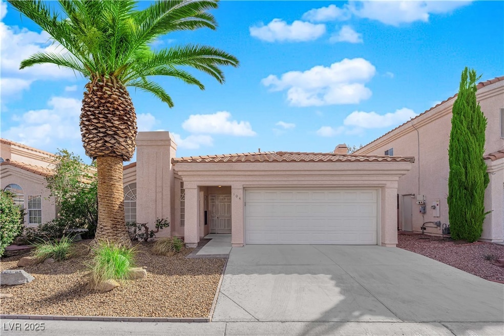 Mediterranean / spanish-style home with a garage,