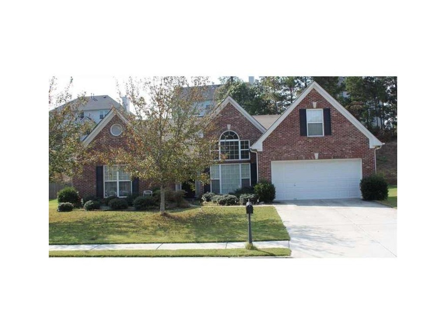 Exterior Front. Brick front, 3 sides concrete sidi