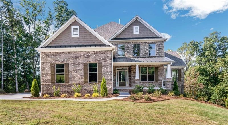 This home is a stunning 3 sided brick, master on t