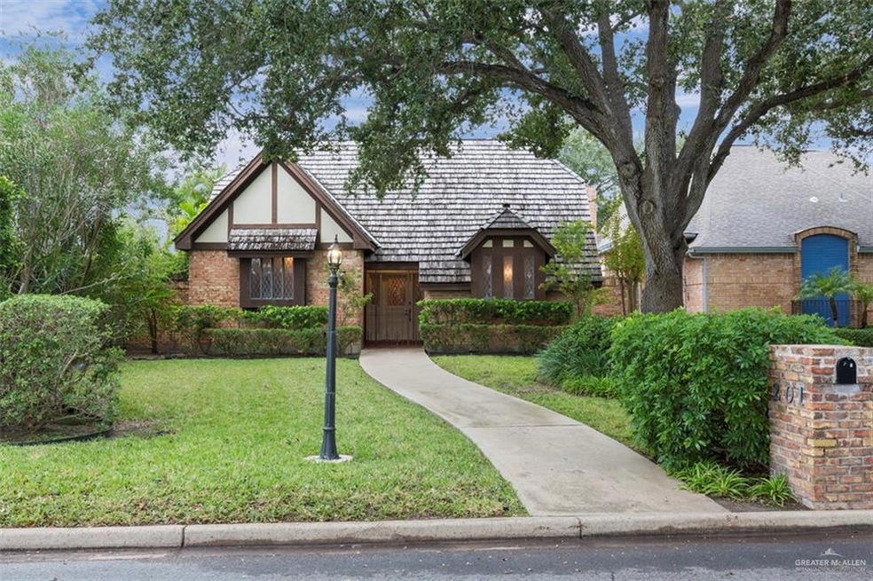 Cozy, Executive Tudor style home with a large oak tree on an oak draped cul-de-sac.  Beautifully, landscaped and prestigious home ready for move in. So many elegant features inside and out.  Tour this McAllen gem and experience beauty inside and out.