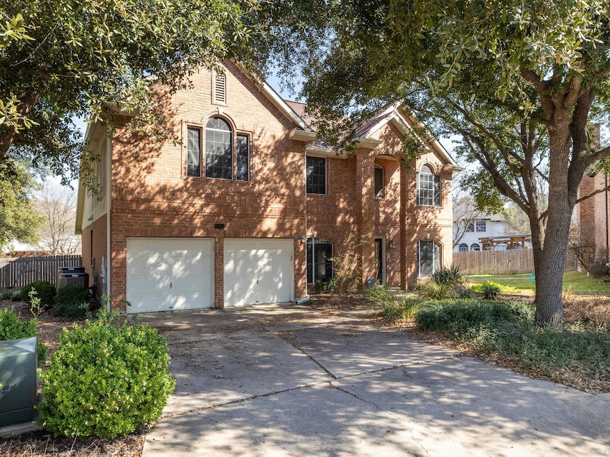 Traditional-style home with an attached garage, f