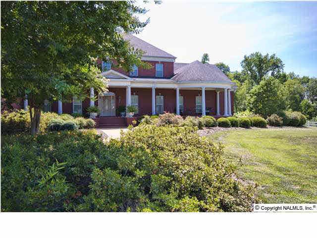 Stately home in the midst of 53 acres of pasture and woods with Piney Creek running through it plus a pond.