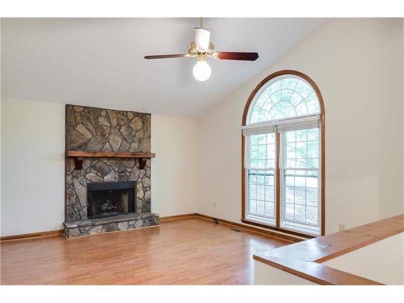 Beautiful windows grace large family room with vaulted ceiling