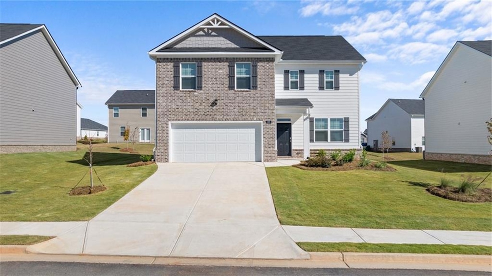 View of front of property featuring a front yard a