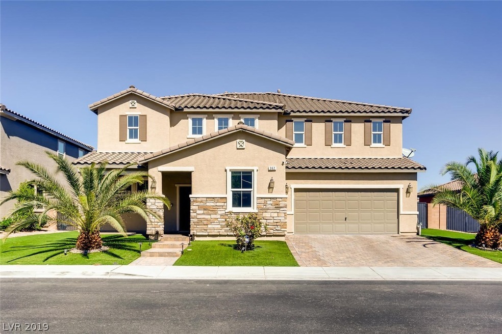 Amazing curb appeal with paverstone driveway, wate