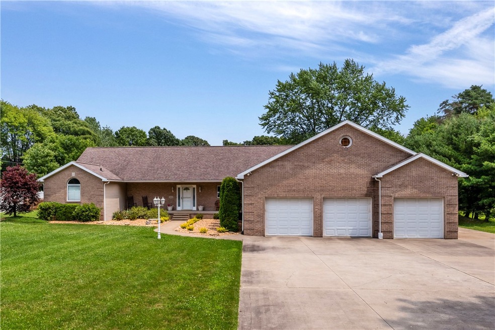BEAUTIFUL SPRAWLING BRICK RANCH WITH 3 CAR ATTACHED GARAGE