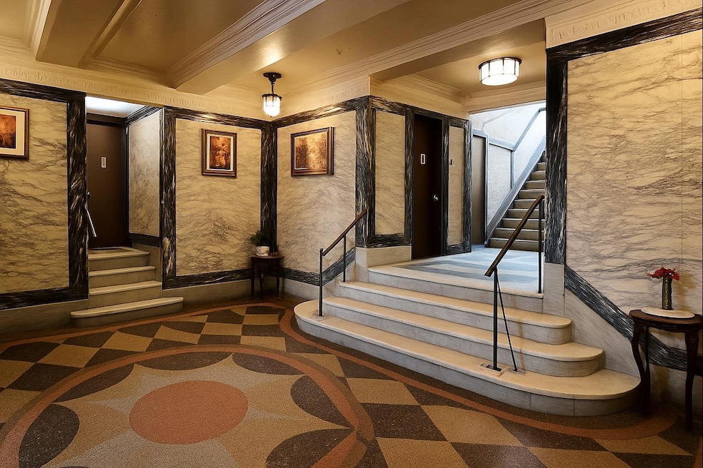 Lobby featuring ornamental molding and stairway