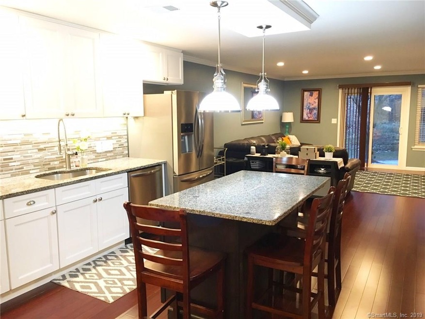 Great room with pristine kitchen and plenty of fam