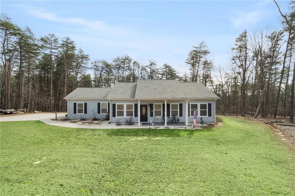 View of front facade featuring covered porch and a
