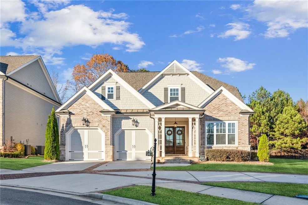 Craftsman-style home featuring a front yard, centr