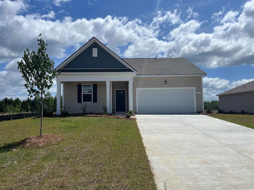 View of front of house with a porch, concrete driv