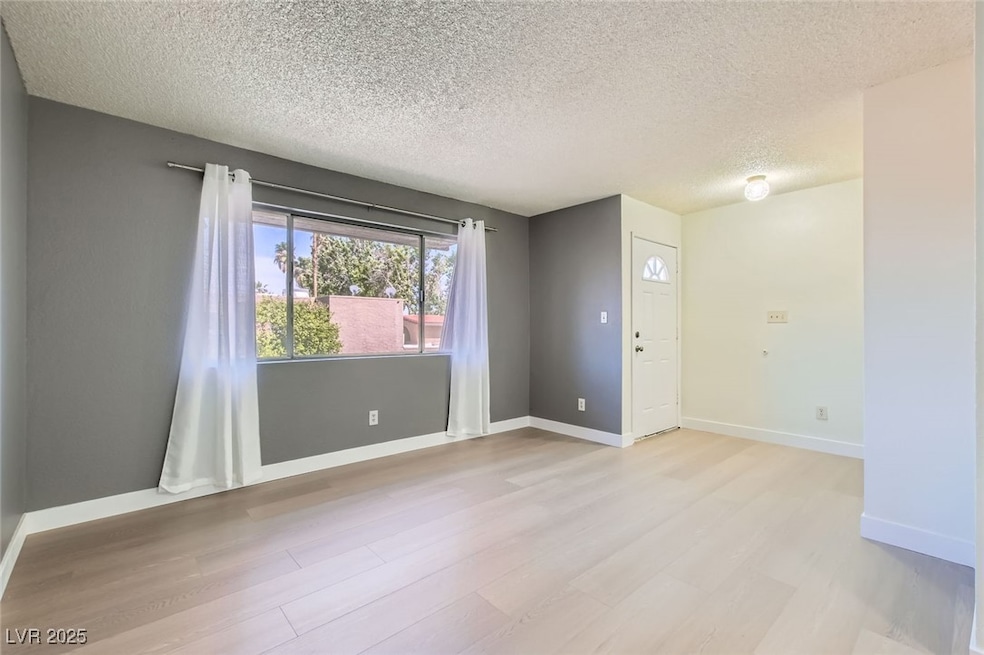 Freshly painted living room w/ new luxury vinyl pl