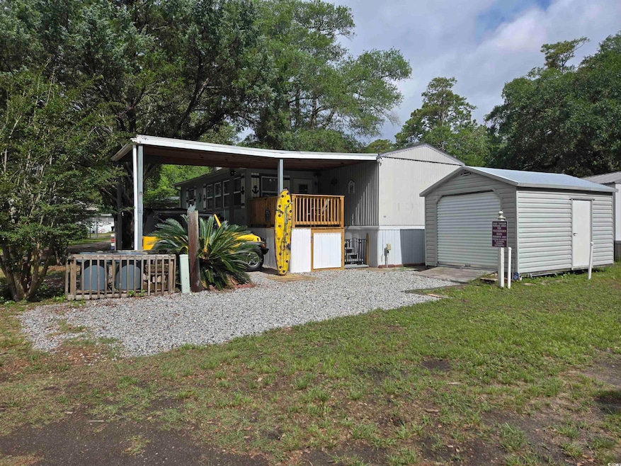 View of shed featuring a carport