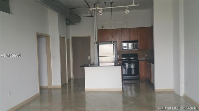 11' ceilings... view to kitchen with kitchen islan
