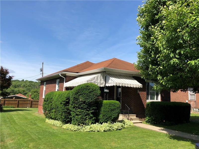 Front of home with shaded porch