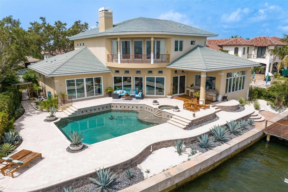 Rear Elevation featuring newer Andersen Window, Sekas Pool and Dock with 2 lifts