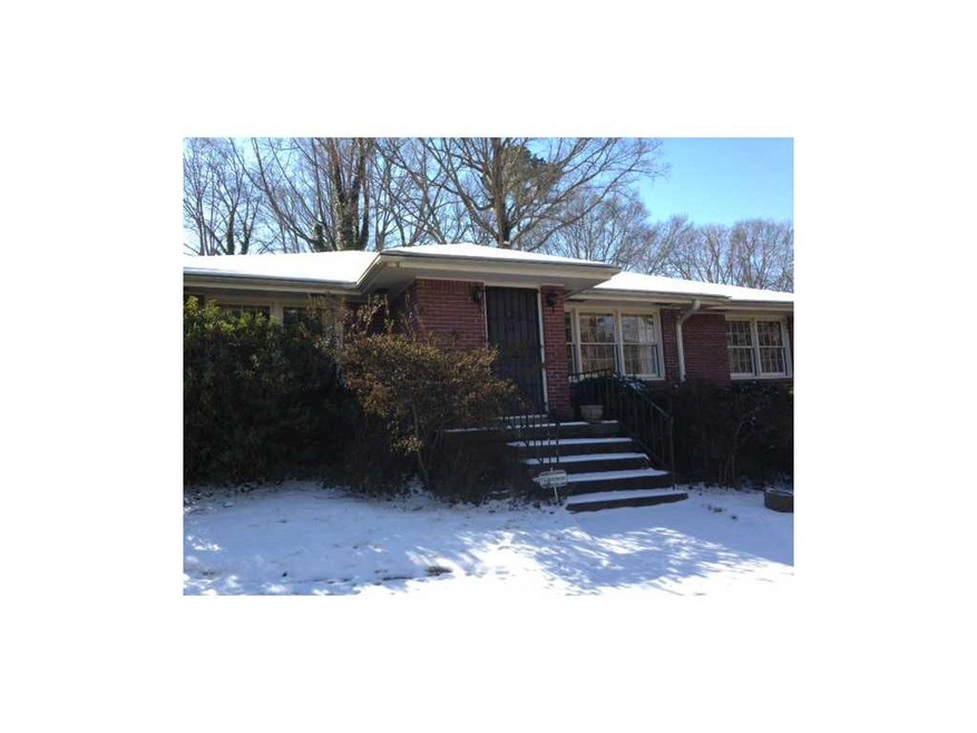 Exterior Front. Brick ranch on a hill with gorgeou