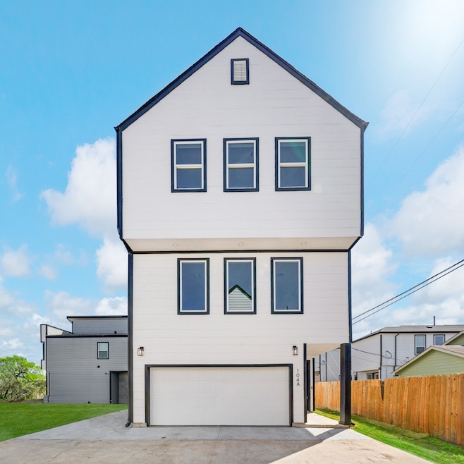 This stunning three-story modern home stands tall