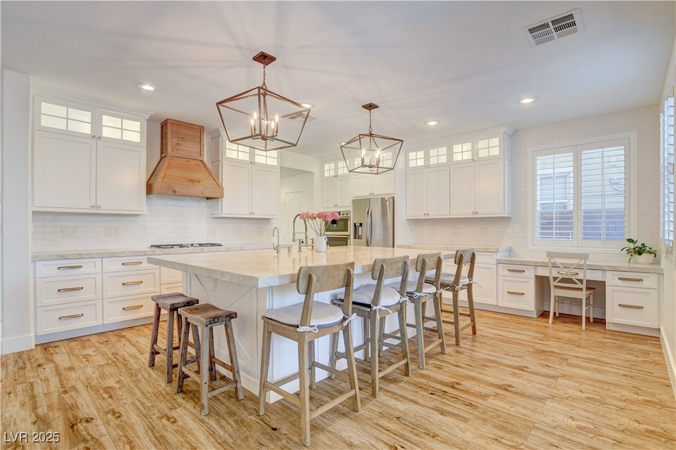Kitchen featuring premium range hood, stainless st