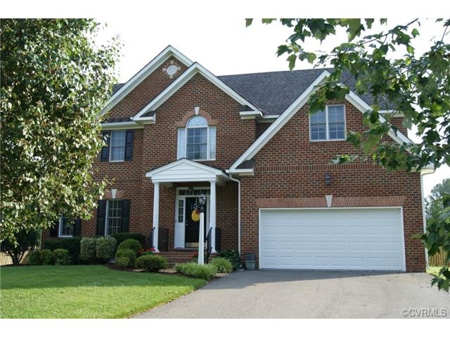 Brick front, vinyl sided home on cul de sac lot in