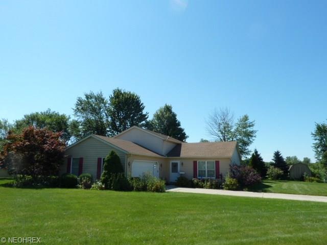 Front View - wood and vinyl siding cement driveway