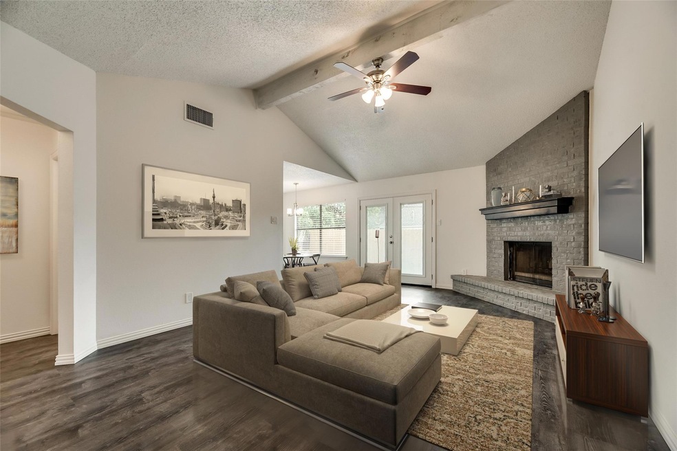 Living room featuring a textured ceiling, ceiling 