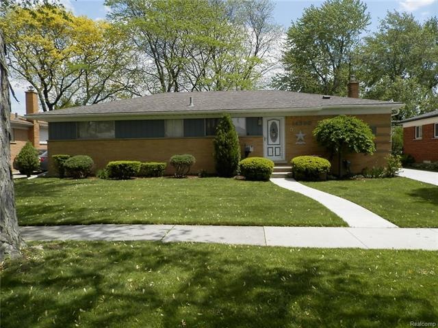 Sprawling low maintenance ranch with manicured landscaping.