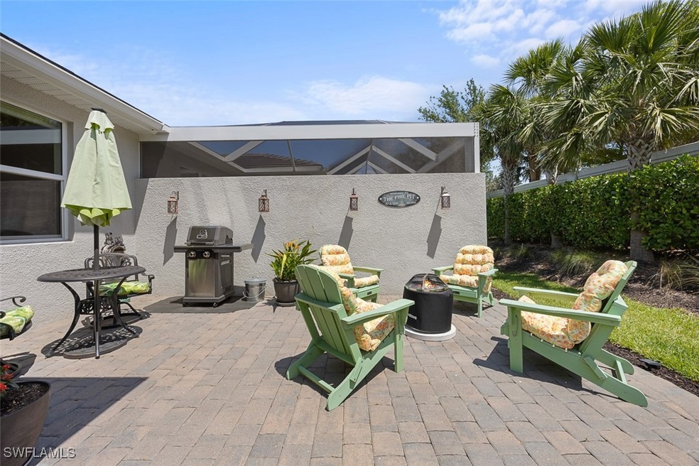 View of patio / terrace featuring an outdoor fire
