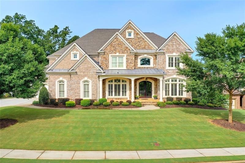 Front Exterior- notice the level front yard and drive and the inviting front porch!