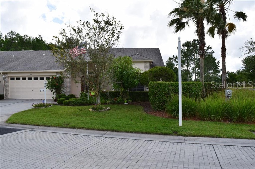 Beautiful end unit villa has lush landscaping and 