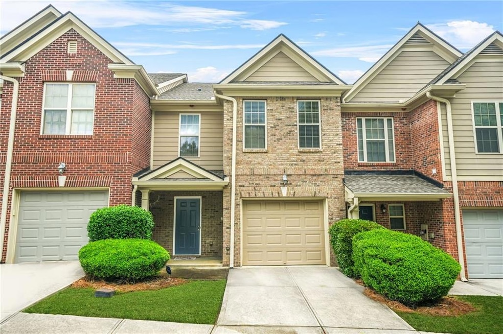 Multi unit property featuring driveway, an attache