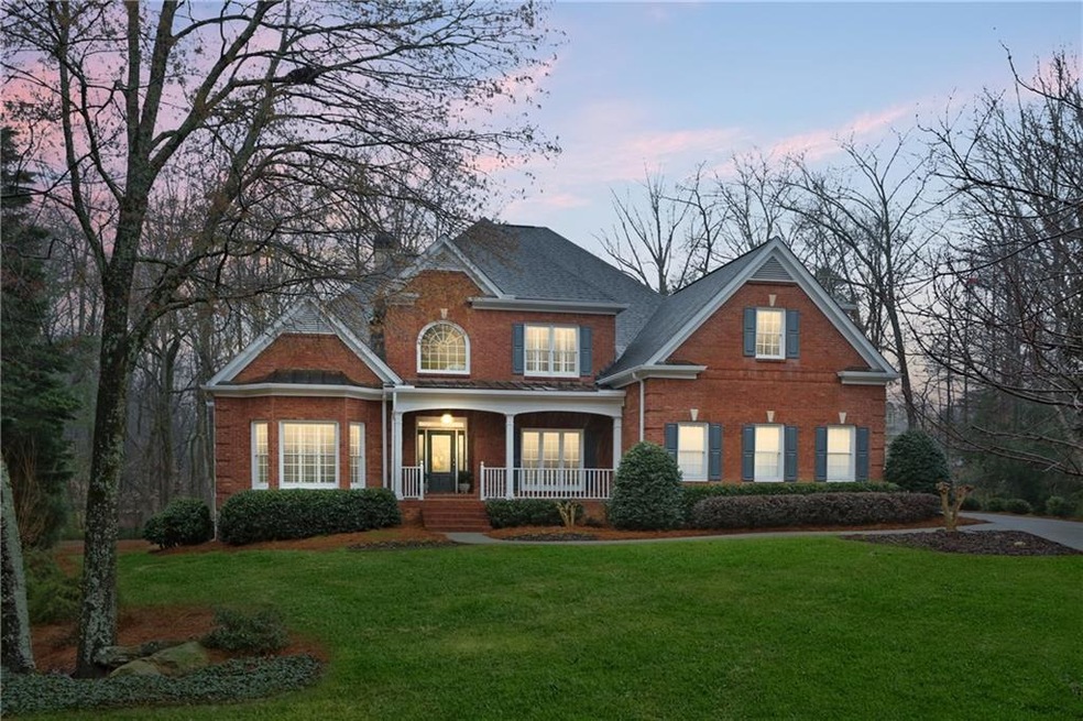 Stately curb appeal with covered front entry and r