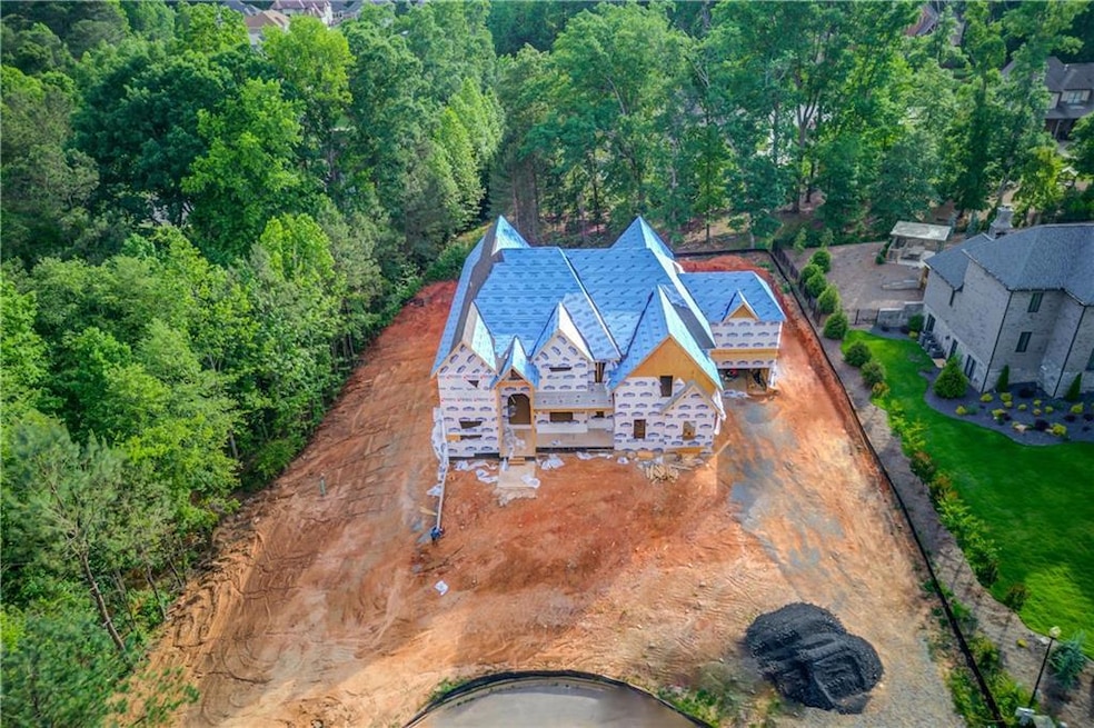 View of subject property featuring a forest