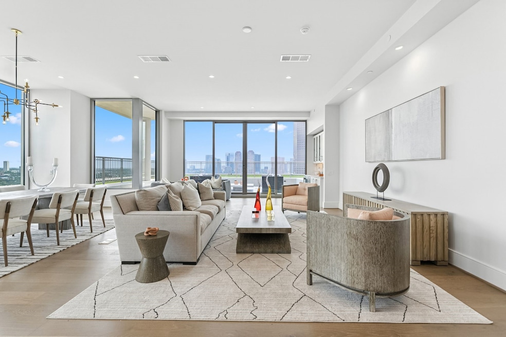 LUXURY-LIVING AWAITS YOU.  Stunning penthouse located on the 15th floor of a luxury high-rise in a prestigious Tanglewood location. Thoughtful floor-plan, engineered hardwood floors throughout and wall of sliding doors opens to a private large terrace