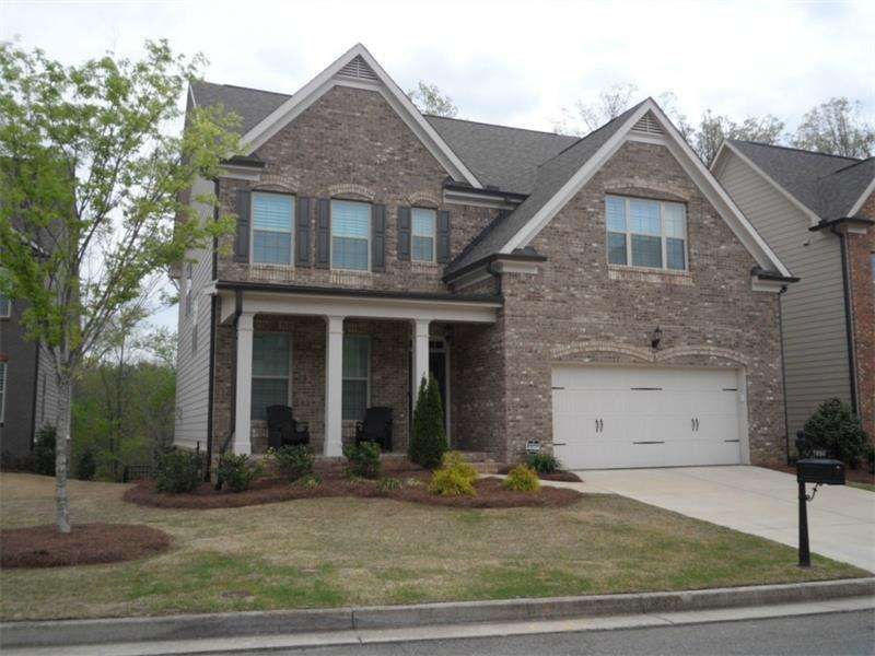 Exterior with rocking chair front porch with Brick