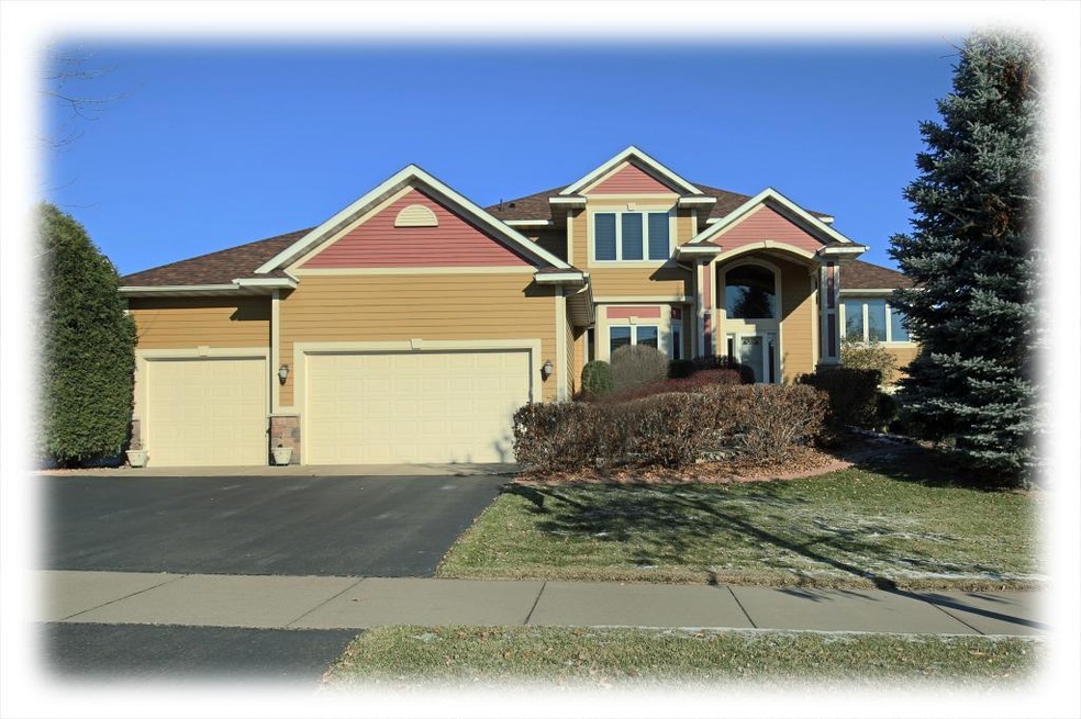 This grand two-story home is nestled on a quiet lo