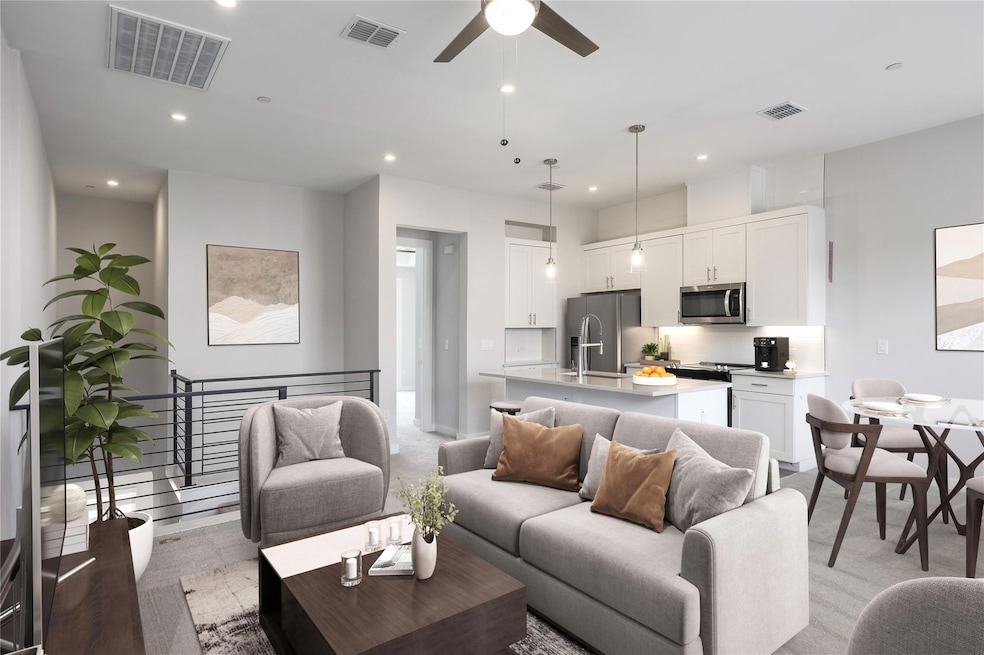 Living room featuring recessed lighting and a ceiling fan (virtually staged)