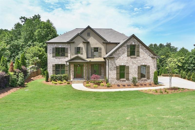 Three Sides Brick with Inviting Front Porch.  Beau