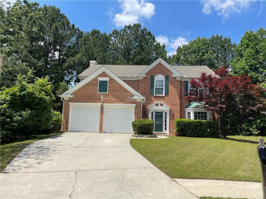 View of front of property featuring brick siding, 