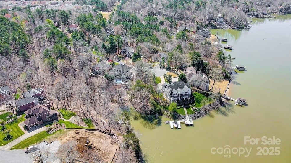 Gorgeous waterfront homesite, surrounded by beautiful hardwood trees, on a quiet cul-de-sac, nestled among fine custom waterfront homes in Tega Cay